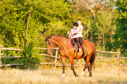 Mother and Daughter Riding Horses